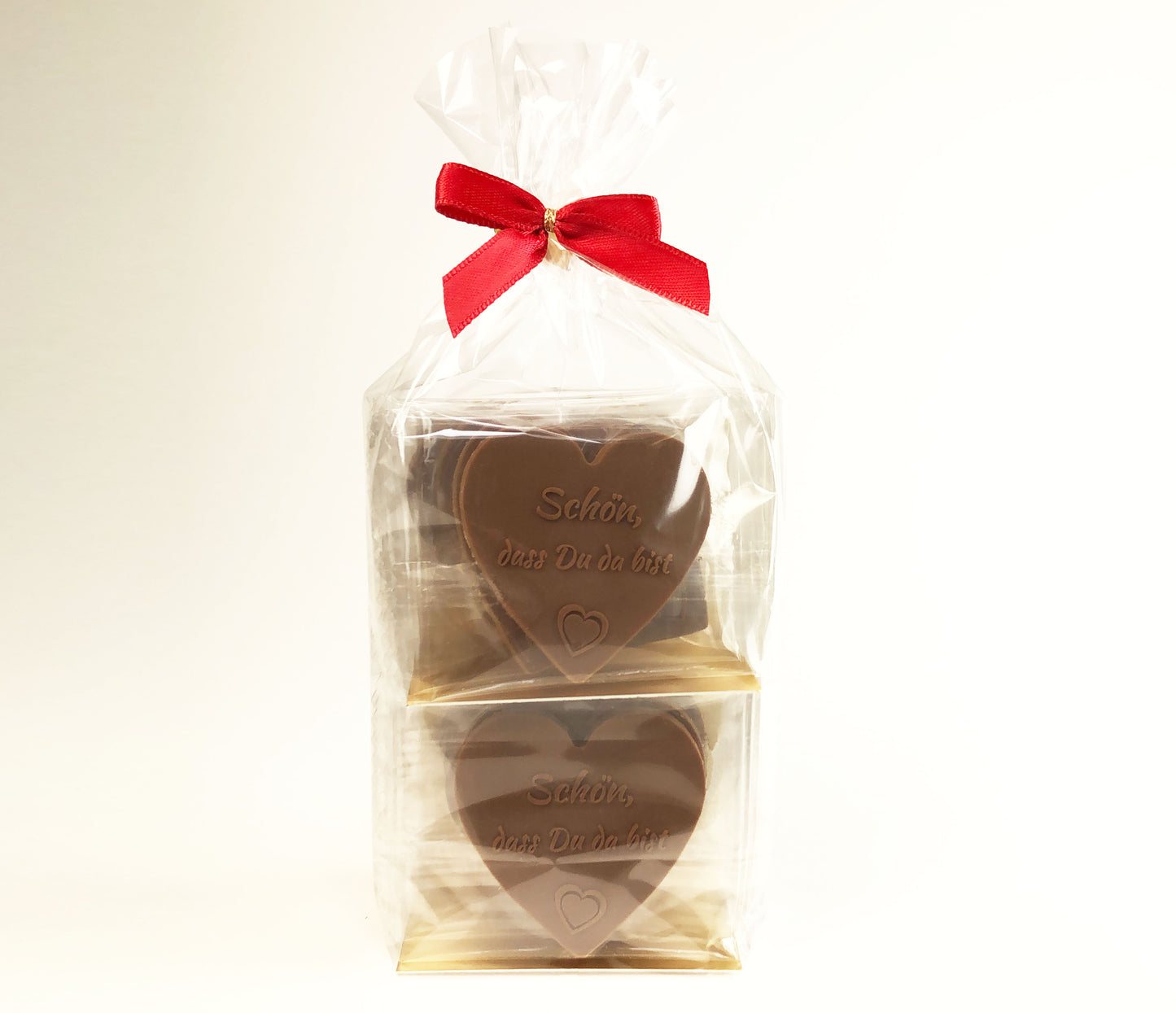 Gastgeschenke Schokoladenherzen - 12 St. aus Vollmilch-Schokolade - 'Schön, dass du da bist' für Gastfreundschaft und besondere Anlässe, Tischdekoration oder Torten-Verzierung